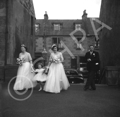 Miller, 'Broomfield,' February 1954. Bridesmaids entering the Old High Church on Church Street, Inve.....