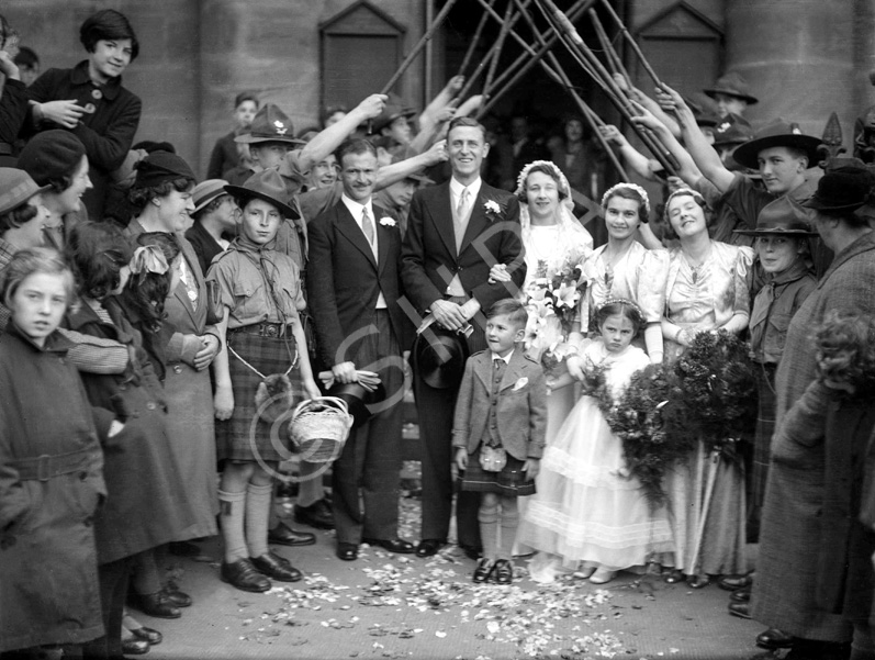 Bridal procession with Scouts and staffs. Possibly taken outside the old West Church in the late 193.....