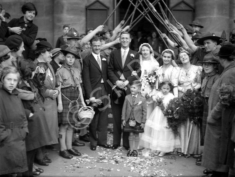 Bridal procession with Scouts and staffs. Possibly taken outside the old West Church in the late 1930s. The leader on the right of the guard of honour is John R. Cowieson, Scoutmaster of the 3rd Inverness (Crown) Troop from 1936. He moved to Fife in the late 40s-early 50s and was District Commissioner and County Commissioner there for a number of years. #
