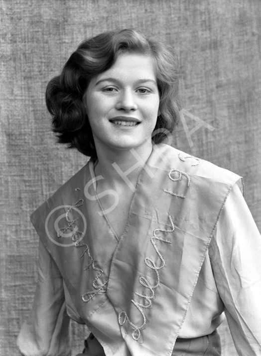 Dolores Law. Sash indicates she was a 'Garry May Queen during the 1950s.  