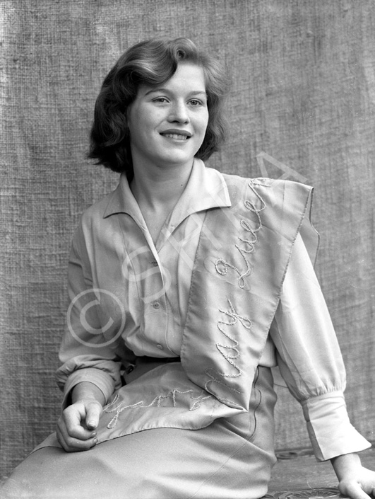 Dolores Law. Sash indicates she was a 'Garry May Queen during the 1950s. 