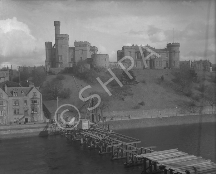 Temporary bridge building Jul-Aug 1939, showing Inverness Castle and Castle Tolmie in background. (Ness Bridge was finally demolished in 1959).* 