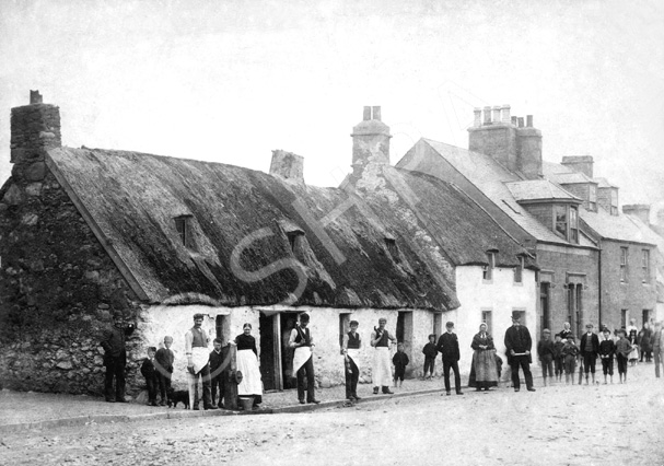 Thatched cottages in Tomnahurich Street, Inverness c.1890s. Water pump on the street corner in front of the house on the left.*  