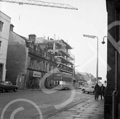 Building and construction of Caledonia House, now the Penta Hotel in Academy Street, Inverness. Originally the site of the Empire Theatre which was demolished in 1971, Caledonia House first appears in the Valuation Rolls of 1973-74. DE Shoes occupied the corner site for many years, next to the rear car park entrance of the Cummings Hotel (which is now the Hush Lounge Bar). The double decker bus is parked outside the building once occupied by Teddy Mountain.*