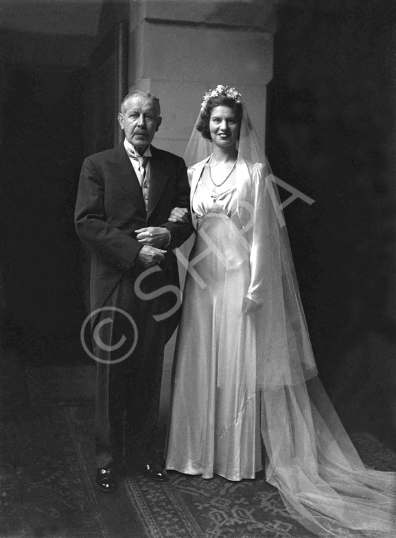 Dawn Ritchie bridal, in the Main Hall at Ardlarach House in Tain. She married Norwegian Eric Prydz and went to live in Norway. She is here with her father Colonel Charles Ritchie. Other siblings were William and Rosemary. William also had a son named Charles. 