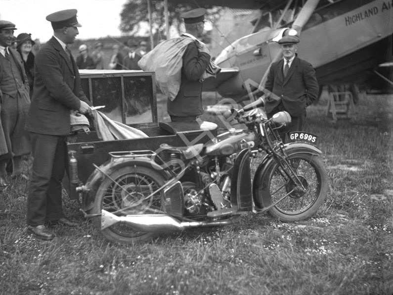 Mail being delivered to a Highland Airways aeroplane. Highland Airways began a passenger service bet.....