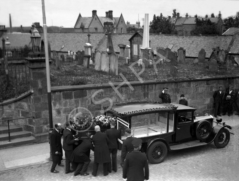 Funeral leaving St. Laurence Parish Church in Forres. The graveyard was used until the mid 19th century, when the Cluny Hill Cemetery was opened. The mainly 18th century gravestones in the church grounds were removed in the 1970s in a 'tidy-up' of the town centre. #  