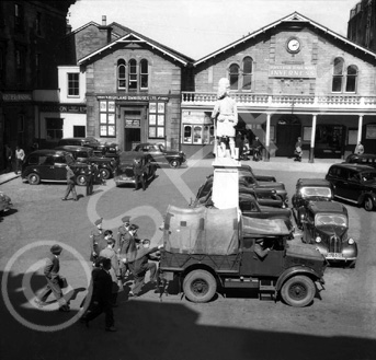 Station Square, Academy Street, Inverness. Training NCOs meeting new recruits at Inverness Station in 1952. After training at Cameron Barracks the recruits would be posted to the 1st Battalion The Queen's Own Cameron Highlanders which was then serving in Austria. *
