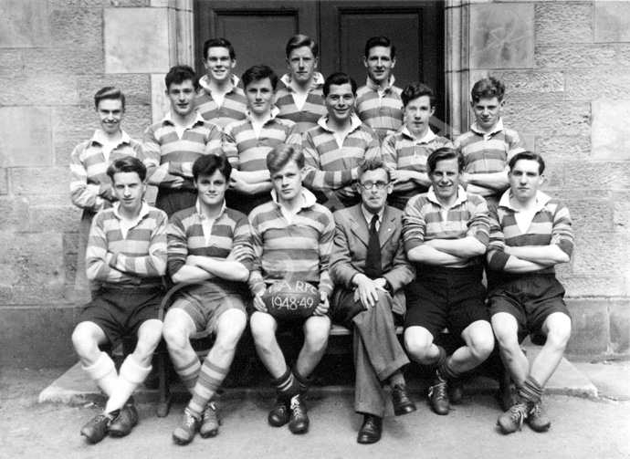 Rugby 1st XV 1948-1949. Rear: Ramsay Rae, Angus MacKenzie, Stanley D. Fleming. Middle: David Fletcher, John Sanderson, W.R Cameron, Martin Forrai, Ivan A. Fletcher, Lewis Nairn. Front: Harold C. Beaton (C), Allan E. Cameron, J. MacKenzie, Mr C.J Buchanan, Scott D. Moffat, Brian MacDonald. (Courtesy Inverness Royal Academy Archive IRAA_011).