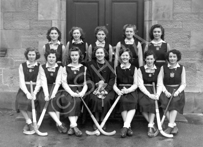 Hockey 1st XI 1946-1947. Team members were: Effie McIntyre (C), Netta Paterson (VC), Peggy MacLeod, Lorna Menzies, Adele Mitchell, Aileen Barr, Belle Munro, Margaret Corbett, Janet Jarrott, Sheila S. Cameron and another. At centre is Miss Maude Yule. (Courtesy Inverness Royal Academy Archive IRAA_020).