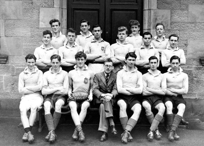 Rugby 1946-1947. Rear: G.F Mackenzie, A. Williamson, J.R Brown, R. Dow. Middle: Alan Douglas, J. Morton, Ian MacArthur, James MacKenzie, Martin Forrai, Brian MacDonald. Front: Donald C. Oliver, Alasdair D. Fraser, Murdo M. Christie, Mr C.J Buchanan, Gordon M. Goulder, John M. Martin, William M. MacDonald. (Courtesy Inverness Royal Academy Archive IRAA_021).