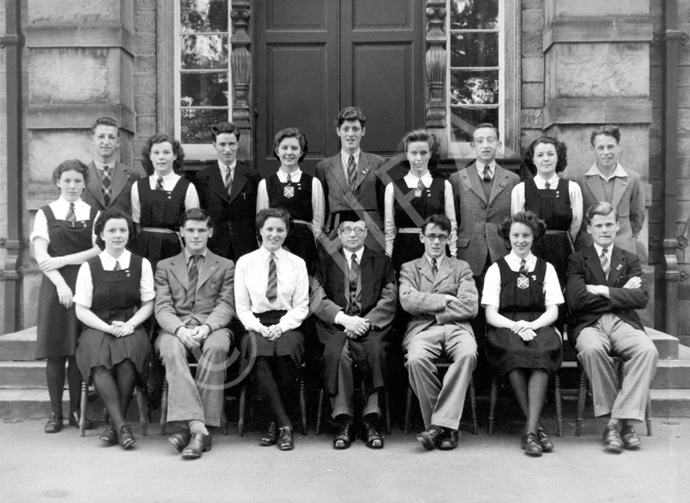 Inverness Royal Academy Prefects 1945-1946. Rear: Sine MacDonald, Brian Heatley, Catherine Tulloch, Donald Oliver, Netta Paterson, M. Christie, E. MacIntyre, H. MacVinish, Rhoda Cameron, Peter Cameron. Front: Elizabeth Rose, Peter Murray (VC), May Murray (C), Rector D.J MacDonald, William Cattell (C), Sheena MacKenzie (VC), Roy Hazle.  (Courtesy Inverness Royal Academy Archive IRAA_041).