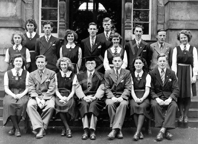 Inverness Royal Academy Prefects 1948-1949. Rear: Peggy MacLeod, Margaret MacLennan, Roderick A. MacLeod, Peggy Fraser, Stanley Fleming, James MacKenzie, Deirdre Munro, Frank Taylor, Ross Martin, Aileen Munro. Front: Erica Donald, Scott Moffatt (VC), Aileen Barr (C), Rector D.J MacDonald, Allan Cameron (C), Lorna Menzies (VC), Angus MacKenzie. (Courtesy Inverness Royal Academy Archive IRAA_045). See also 1878b-e. 