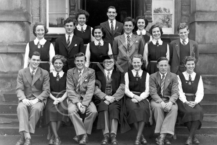 Inverness Royal Academy Prefects 1949-1950. Rear: Vaila MacLeod, John Sanderson, Sandra Oliver, Judy Kelly, Brian MacDonald, Will Cameron, Kathyrn Robertson, Aithne Rogers, Lewis Nairn. Front: Ramsay Rae, Peggy MacLeod (VC), Scott Moffatt (C), Rector D.J MacDonald, Aileen Munro (C), Ross Martin (VC), Deirdre Munro. (Courtesy Inverness Royal Academy Archive IRAA_060).