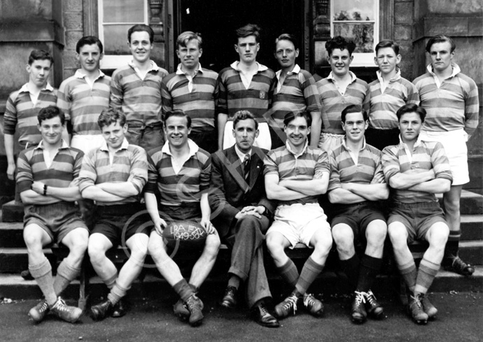 Rugby 1st XV 1949-1950. Rear: Ivan Fletcher, Garry MacNaughton, Ian Notman, John Williams, Alistair MacPherson, Morton Fraser, Donald W. Fraser, James Smith, Michael Maxwell. Front: John Sanderson, Lewis Nairn, Scott Moffatt (C), Mr C.J Buchanan, Brian MacDonald, Ramsay Rae, Will Cameron. (Courtesy Inverness Royal Academy Archive IRAA_061).