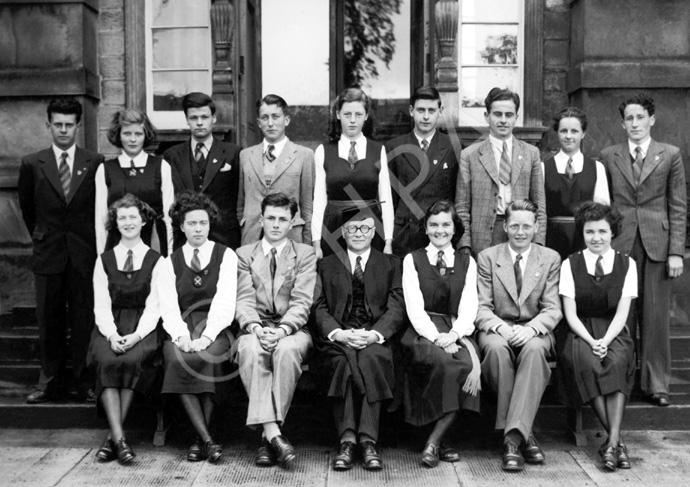 Inverness Royal Academy Prefects 1950-1951. Rear: Donald W. Fraser, Sylvia MacLeod, Gordon Beveridge, Derrick MacLennan, Annabel Brown, Duncan MacKenzie, Neil Smith, Esther Marr, Donald C. MacKenzie. Front: Jessmar Williamson, Sandra Oliver (VC), Will Cameron (C), Rector D.J MacDonald, Judy Kelly (C), Morton Fraser (VC), Kathryn Robertson. (Courtesy Inverness Royal Academy Archive IRAA_065).