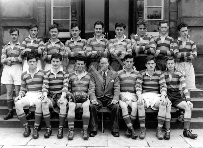 Rugby 1st XV 1951-1952. Rear: Maurice Love, Alistair MacBeath, James Griffiths, Ronald Leishman, Ian Notman, Will Cameron, John Brown, Alistair MacDiarmid, Arthur Griffiths. Front: James Cameron, Sandy Sanderson, Donald W. Fraser (C), Mr Murray, Garry MacNaughton (VC), Alistair MacPherson, Donald Robin. (Courtesy Inverness Royal Academy   Archive IRAA_073).