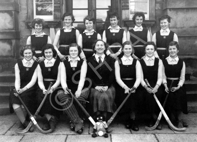 Hockey XI 1953-1954. Rear: K. Kane, V. Beveridge, S. Love, M. Sinclair, P. MacLeod, E. Grant. Front: A. Robertson, J. Fraser, S. Martin, Miss Maude Yule, H. Rose, H. MacAuley, E. Farquhar. (Courtesy Inverness Royal Academy Archive IRAA_083).