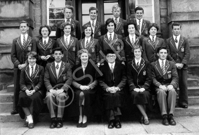 Inverness Royal Academy Prefects 1955-1956. Rear: Arthur Millwood, Alex MacNiven, John Robertson, Roderick MacKenzie. Middle: Ian Robin, Riona Marr, Ishbel Cameron, Carol Gordon, Iris More, Shonaid Robertson, Jean Stoker, John Miller. Front: Chrisalda MacKay, Robert Dewar, Miss E. Forbes, Rector D.J MacDonald, Mary Porteous, Ian MacPhee. (Courtesy Inverness Royal Academy Archive IRAA_098).