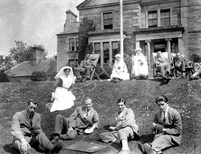 Recuperating soldiers and nurses relaxing on the front lawn of Hedgefield House Red Cross Hospital d.....