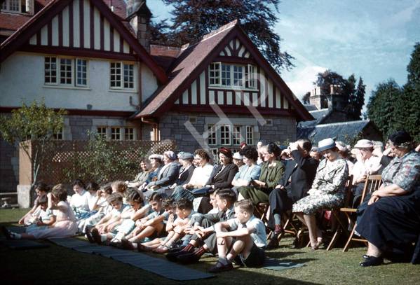 Opening of the new Carrol House Orphanage, Island Bank Road, Inverness. The Carrol House Orphanage was officially opened at 3.00pm on Wednesday 26th August 1959 by Lady Maud Baillie CBE. Eighteen children, cared for by the Highland Orphanage Trust, moved from the old building in Culduthel Road a few weeks previously and settled in to the more compact and up-to-date premises. Robert Gilbert, chairman of the Board of Governors presided at the well-attended ceremony, which was also addressed by Provost Robert Wotherspoon. The matron was Mrs M. Maclean and the two house-mothers were Miss I. Ross and Miss N. Donaldson. A bouquet was presented to Lady Baillie by Heather la Freniere, one of the children in the home. (Courtesy James S Nairn Colour Collection). ~