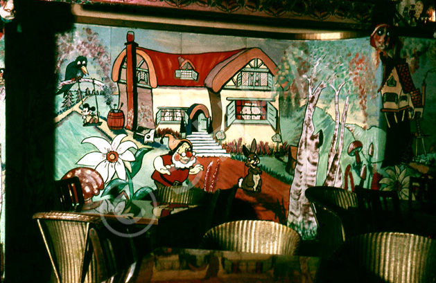 Playhouse Cinema foyer and restaurant, Christmas 1957. Every Christmas season, James Nairn, photographer and manager of the Playhouse, would decorate the foyer and cafe with hand painted cartoon and Disney themes to the delight of visiting children. The Playhouse Cinema was destroyed by fire in 1972, and sadly James Nairn lost the bulk of his photographic and memorabilia archives. (Courtesy James S Nairn Colour Collection). ~ *
