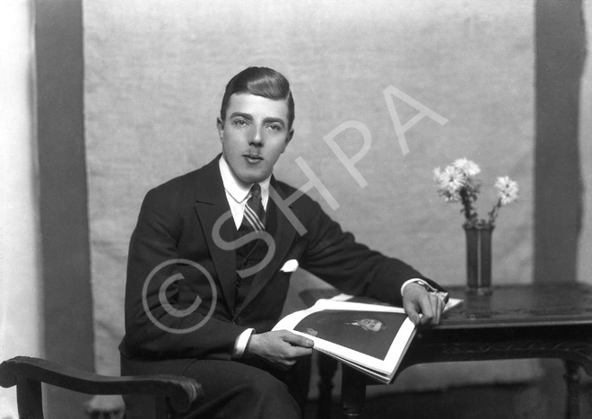 Young man seated, Dec 1927. # .....