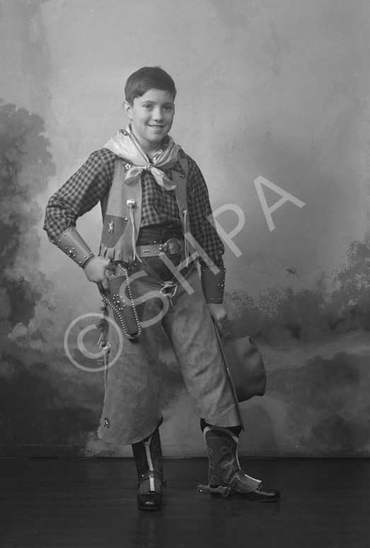 Andrew Chalmers dressed in a cowboy costume for a fancy dress party c1947. (see also refs: 33898, 39.....